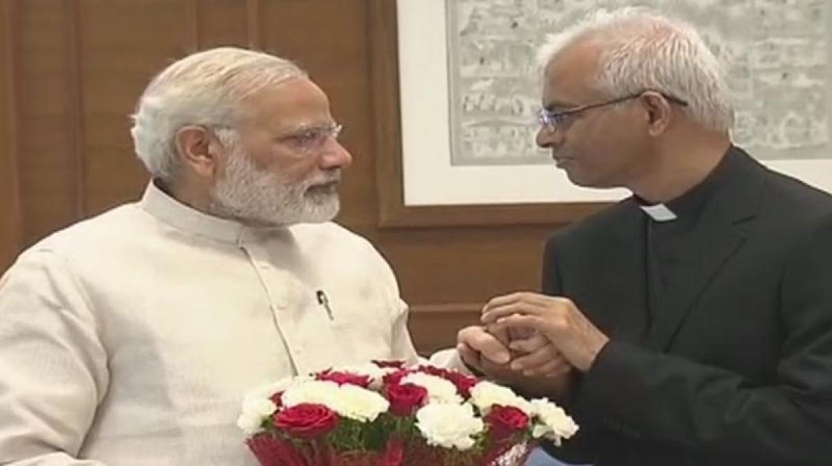 Rescued from ISIS captivity, Father Tom reaches India, meets Modi, Swaraj